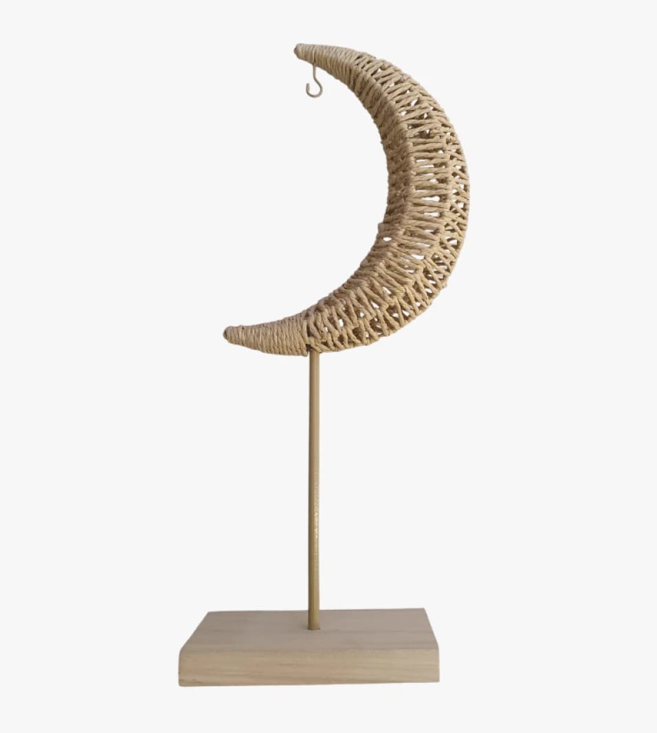 Elegant Wicker Crescent Moon Decor with Wooden Stand for Offices and Living Rooms Interior Design.
