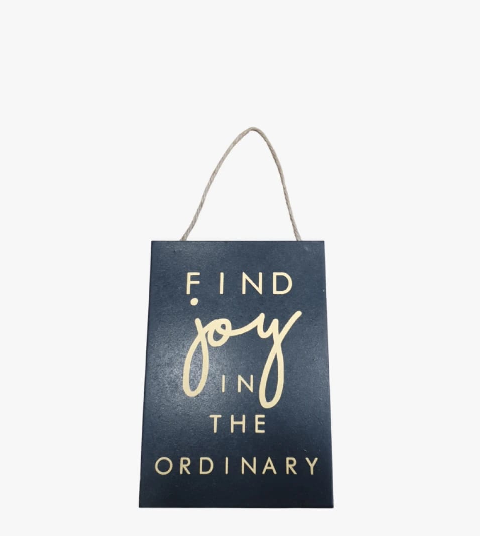 Decorative Wooden Wall Plaque with Unique Design Featuring a Motivational Phrase for Finding Joy in the Ordinary, Perfect Gift for Art Lovers.